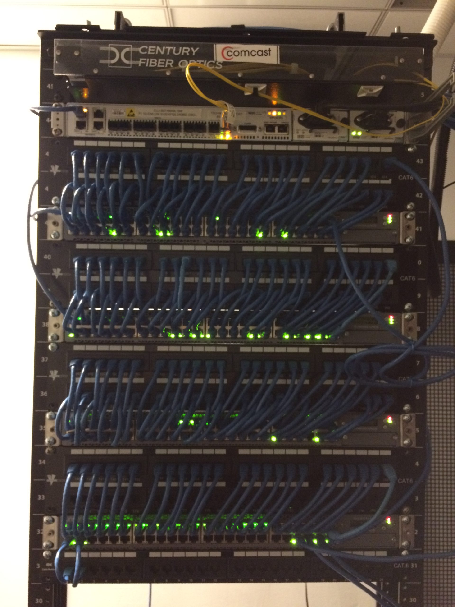 A large office in Charlotte NC has 4 network switches and 200 network cables. all the wires are run run neatly and are serviceable because of our network rack cleanup service.
