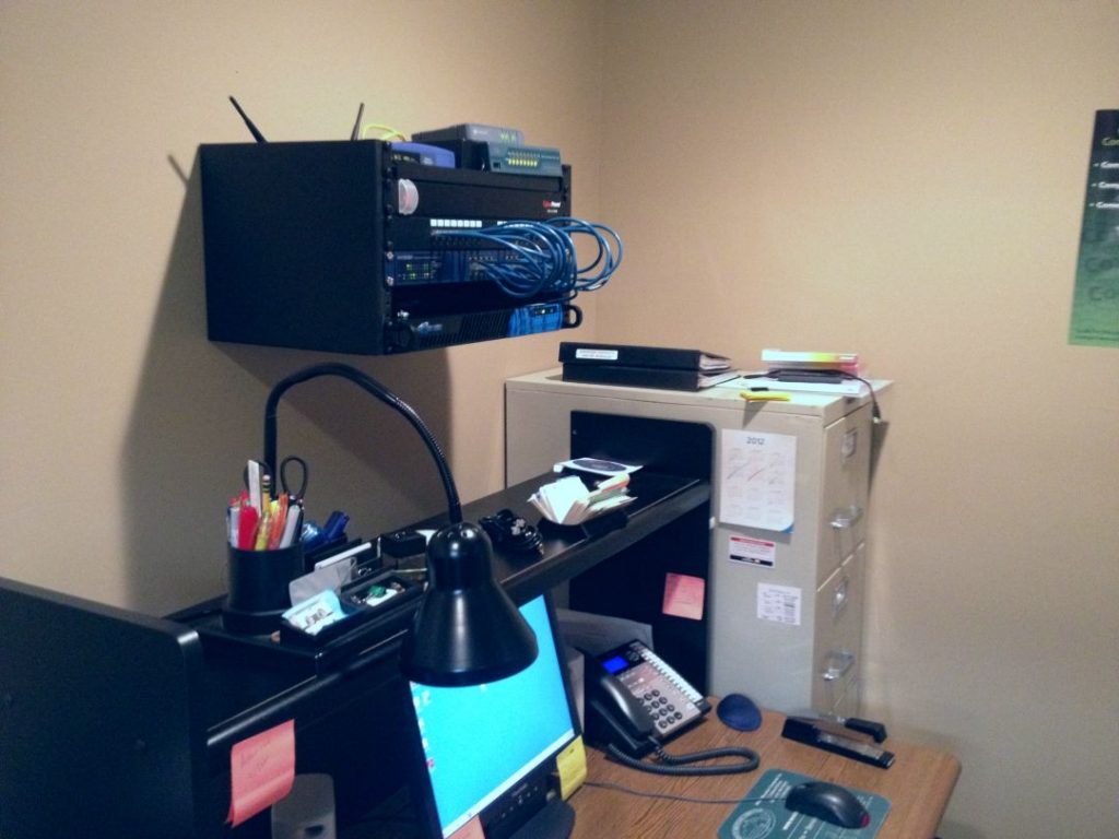 Small office has a Network Rack that has been cleaned up. All wires are delicately placed and does not look cluttered.
