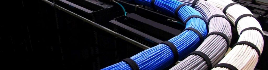 Network Cabling Charlotte NC - Three bundles of dressed network cables run over a Ladder Rack cable tray to a network server.