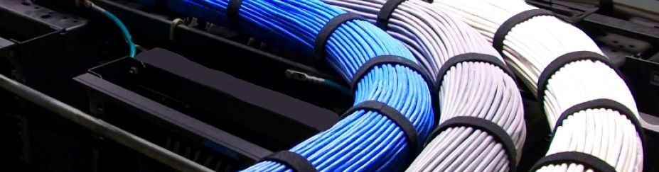 Data Cabling North Carolina running very neatly organized cables on a cable tray wrapped with black verco.
